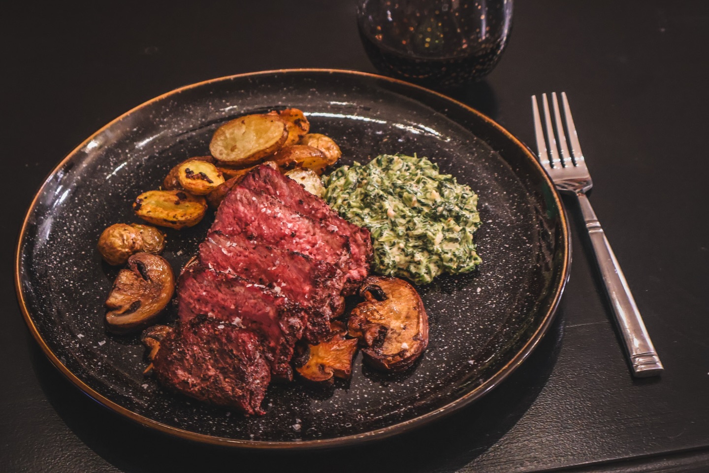 When I say we have steakhouse at home…..

@snakeriverfarms American wagyu ribeye filet, grilled to the perfect medium rare. Served with creamed spinach, roasted potatoes and sautéed mushrooms. Served with a glass of red wine to round out the perfect meal. 

#TeamSRF #thesrfexperience #wagyu #steak #steakhouse
